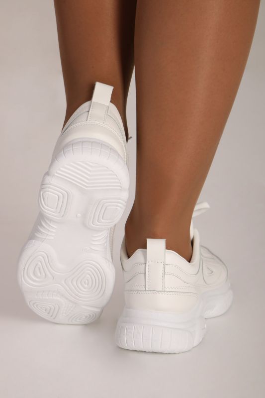 Sneakers are white and massive